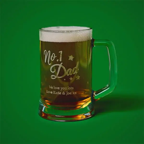 Personalised engraved beer tankard filled with beer, featuring a Number 1 Dad message and custom text.